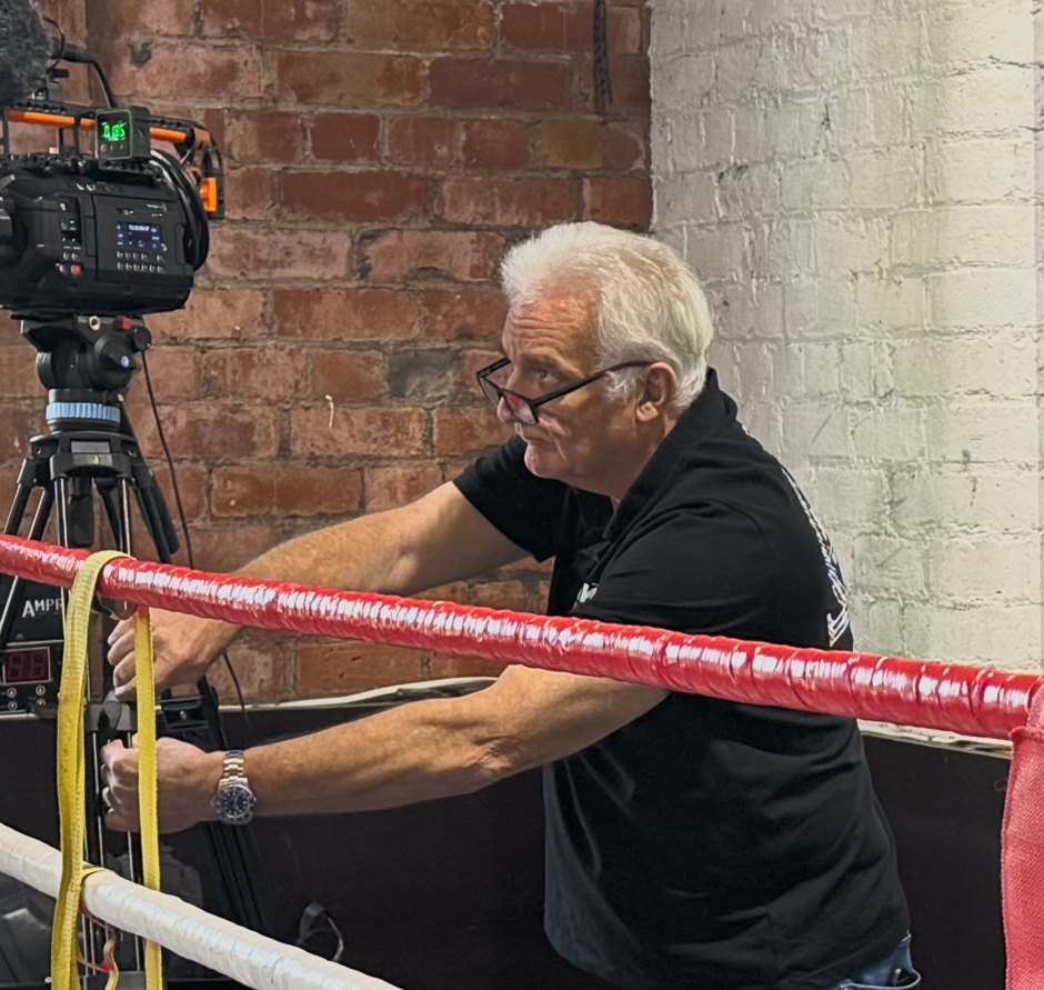 Dean Hall configuring an immersive camera system in a boxing ring